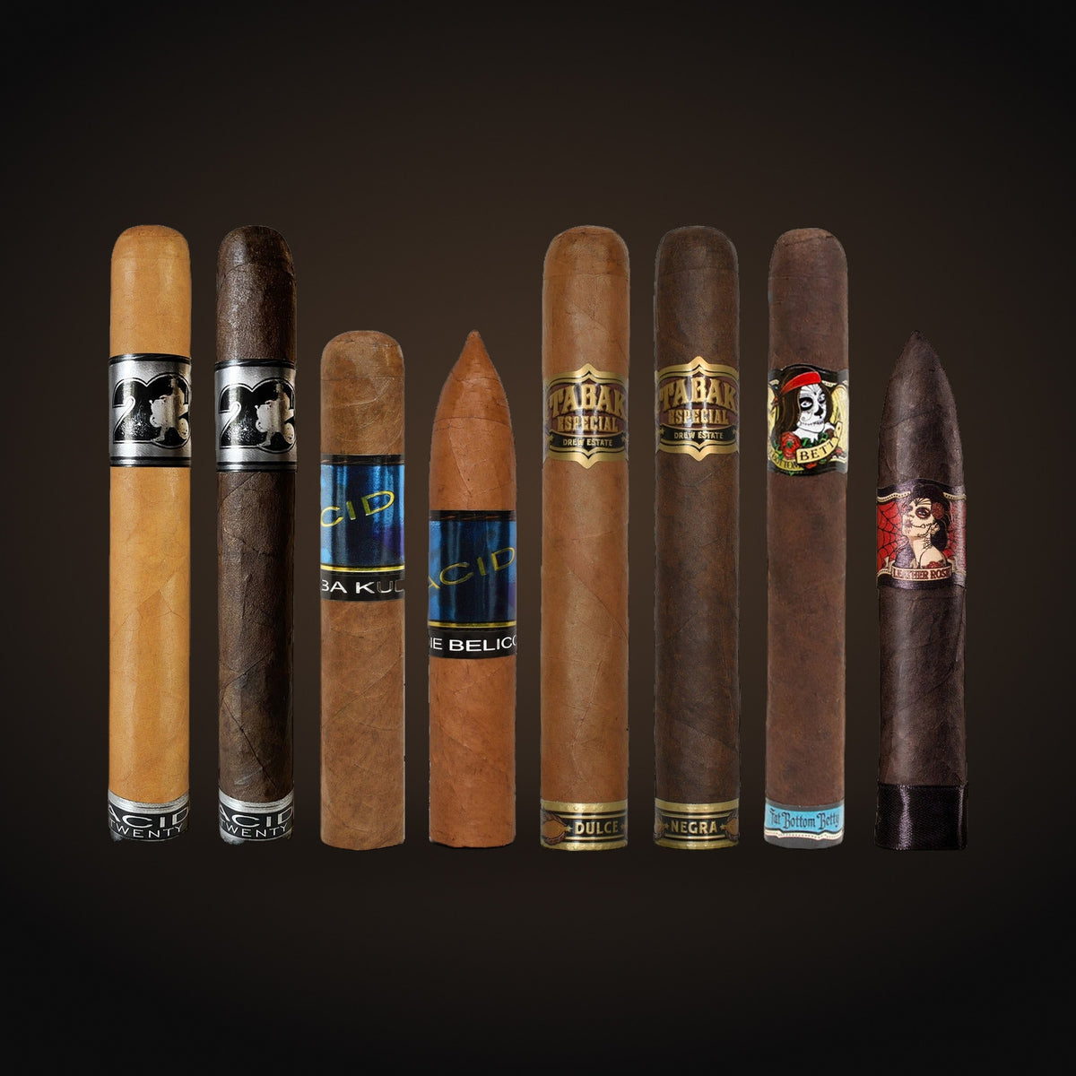 Drew Estate Infused & Non-Traditional 8-Cigar Sampler, assorted cigars side by side — Sun of a Gun Cigars & Spirits, Yuma Arizona