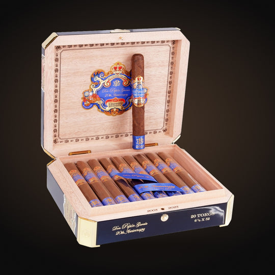 My Father Don Pepin Garcia 20th Anniversary Limited Edition 2023 Toro Blue, open box with a cigar on the lid — Sun of a Gun Cigars & Spirits, Yuma Arizona