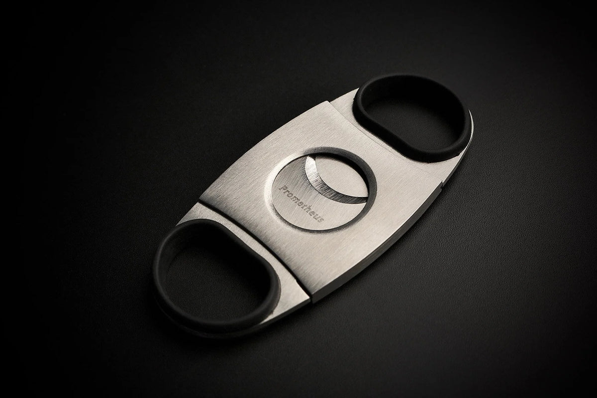 Prometheus Cutter KKP stainless steel double blade cigar cutter with black rubber grips, closed