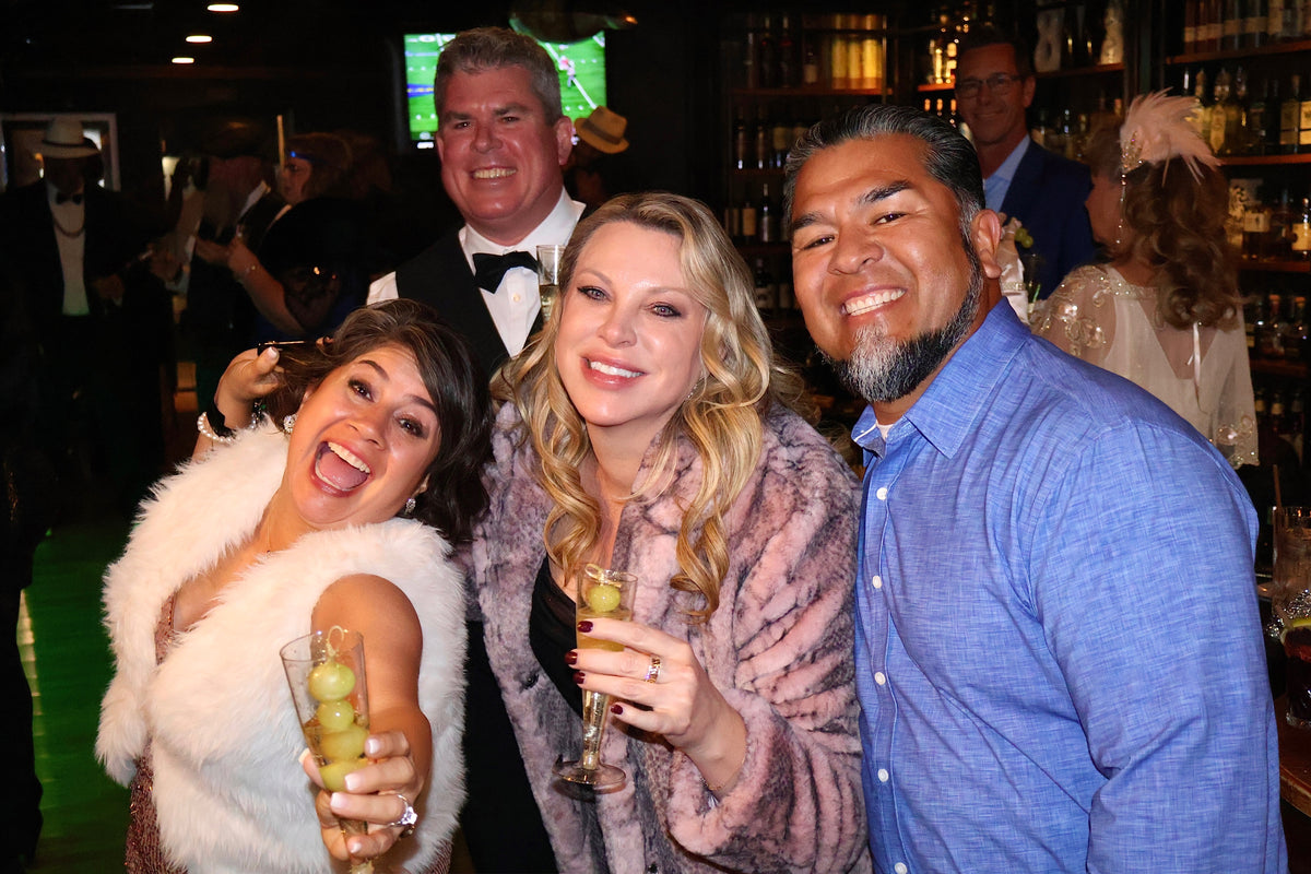 Guests raising a glass during an evening at Sun of a Gun Cigars & Spirits, Yuma, Arizona