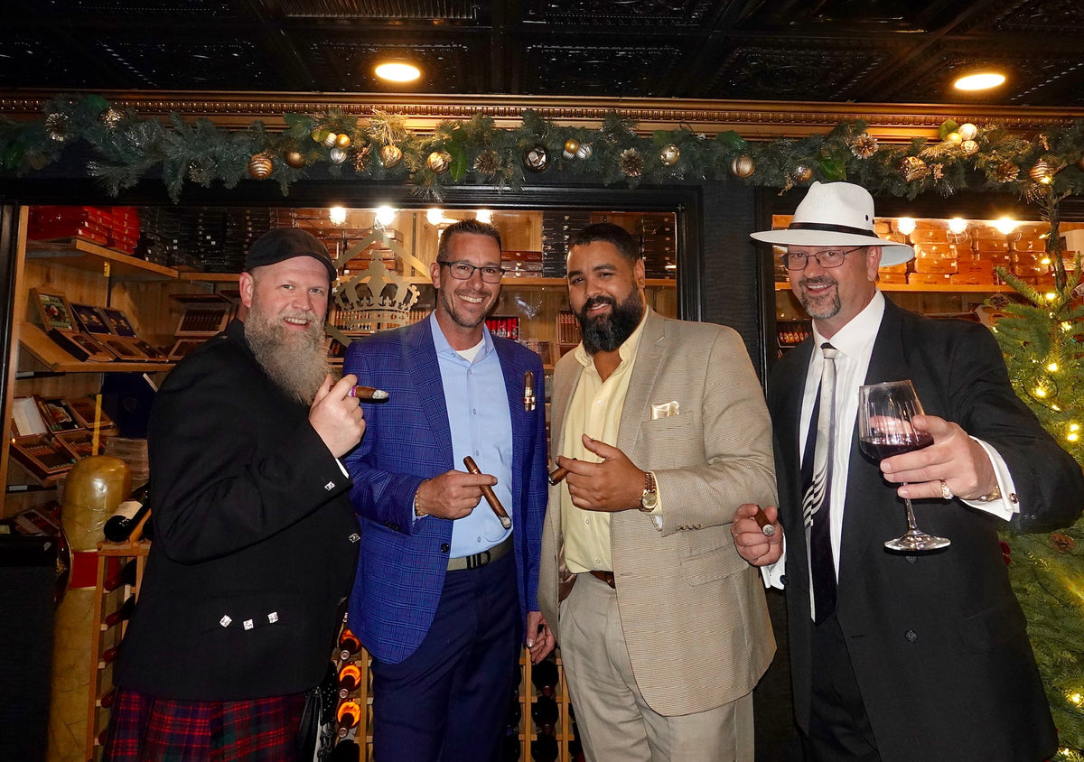 Guests with cigars and wine in the lounge at Sun of a Gun Cigars & Spirits, Yuma, Arizona