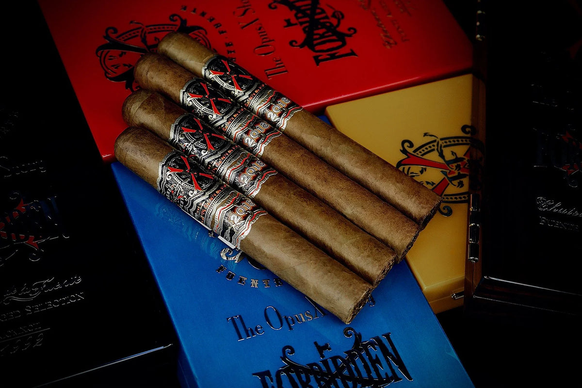Fuente Fuente OpusX Story travel humidor open with four Forbidden X cigars