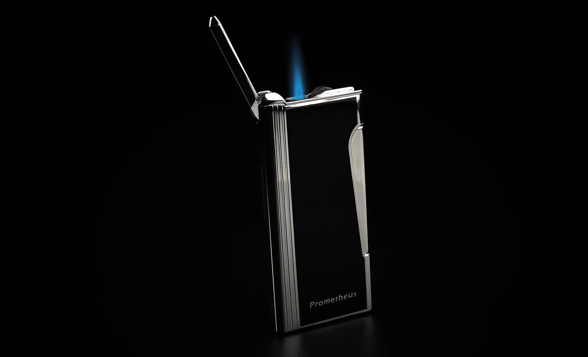 Prometheus Retro black lacquer lighter, lid open with single torch flame lit