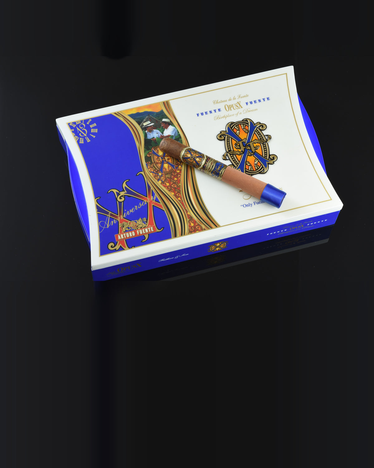 Arturo Fuente Opus X 20th Anniversary box with a cigar resting on it