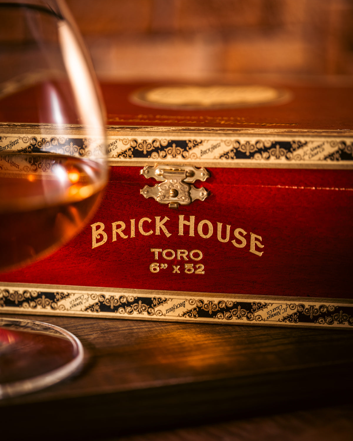 Brick House Toro box beside a glass