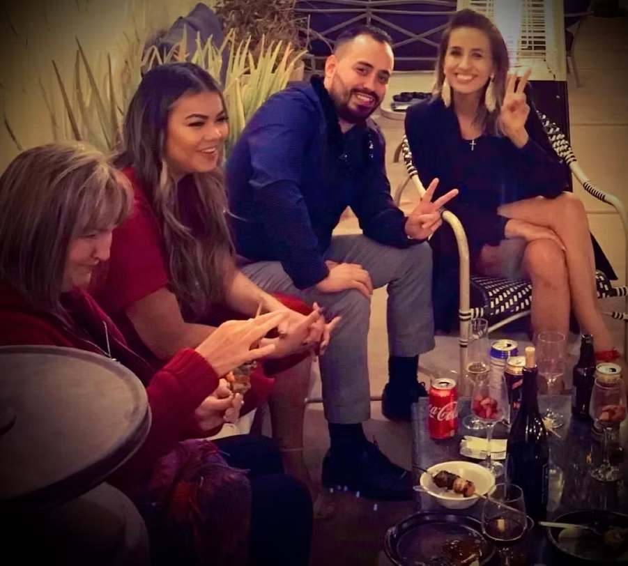 Guests seated on the patio in the evening at Sun of a Gun Cigars & Spirits, Yuma, Arizona