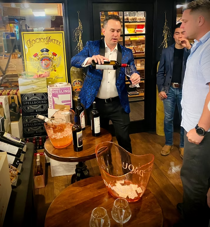 Wine being poured at a tasting event at Sun of a Gun Cigars & Spirits, Yuma, Arizona