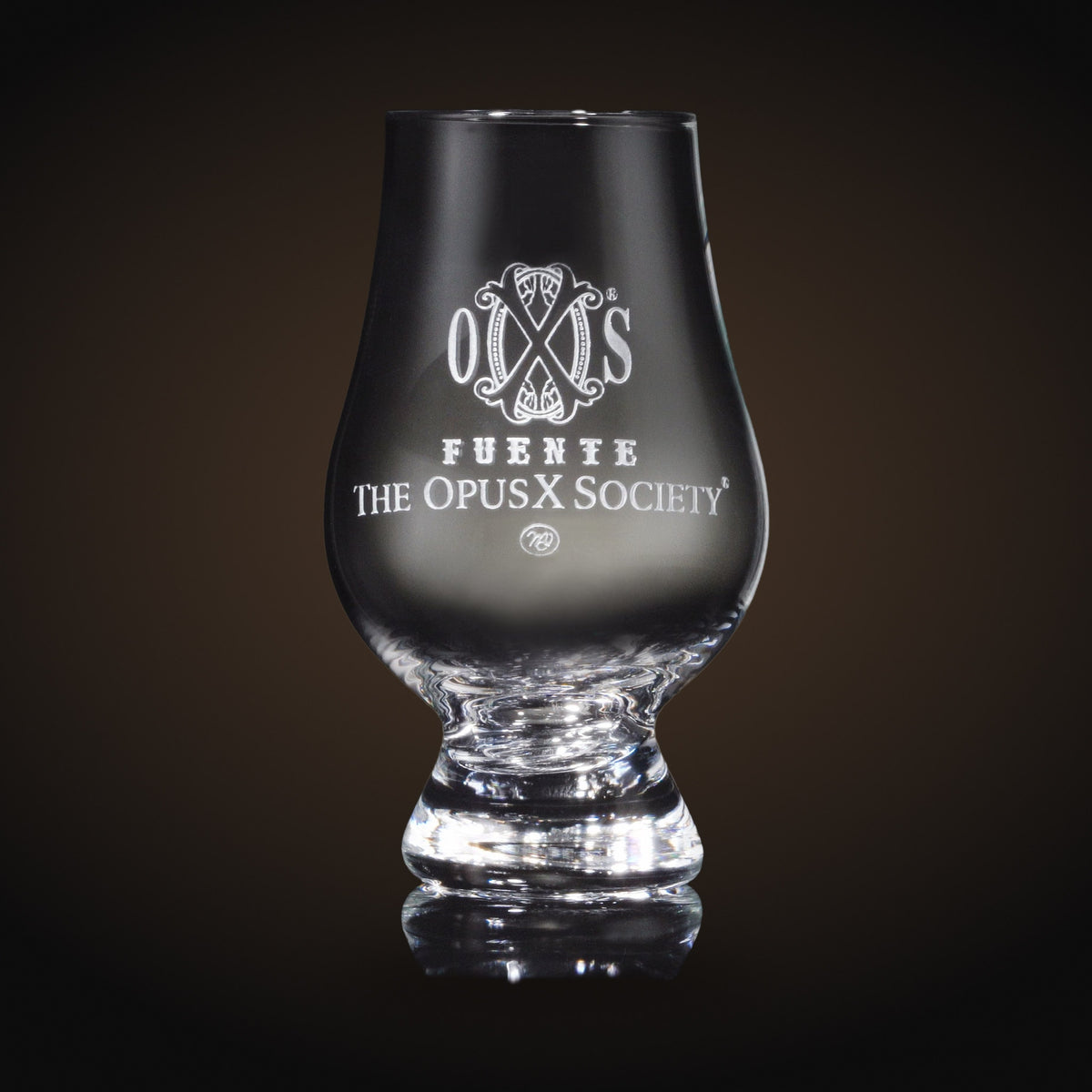 OpusX Society Glencairn whisky glass sand-carved with the OXS emblem and Fuente The OpusX Society — Sun of a Gun Cigars & Spirits, Yuma Arizona