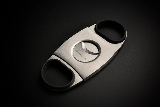 Prometheus Cutter KKP stainless steel double blade cigar cutter with black rubber grips, closed